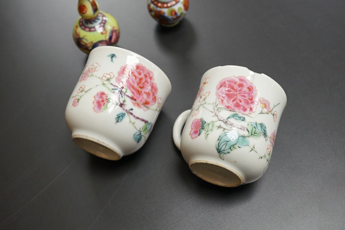 Two Chinese famille rose cups, Yongzheng period and two miniature clobbered vases, largest 6cm high